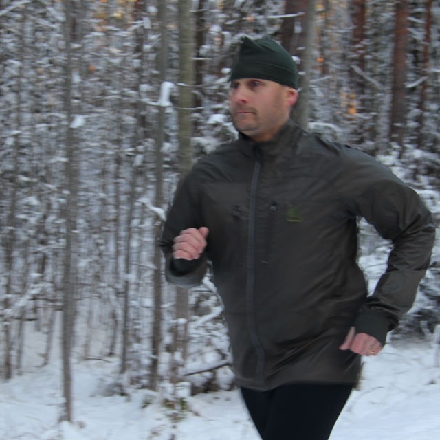 Full arm movement during running in a Running Jacket Green.