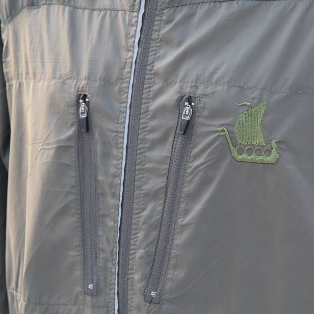 Slight slanted double breast zippers on a Running Jacket Green.