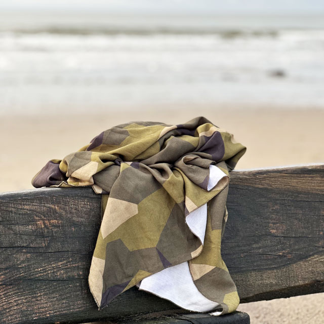 Sarong M90 Camouflage from TAC-UP GEAR on wood at the beach