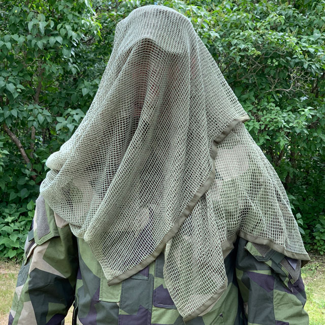 Front view of a draped Scrim Net Scarf Green