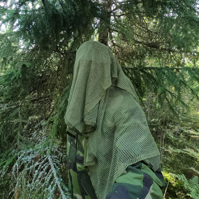 Scrim Net Scarf Green draped and in the Swedish forest
