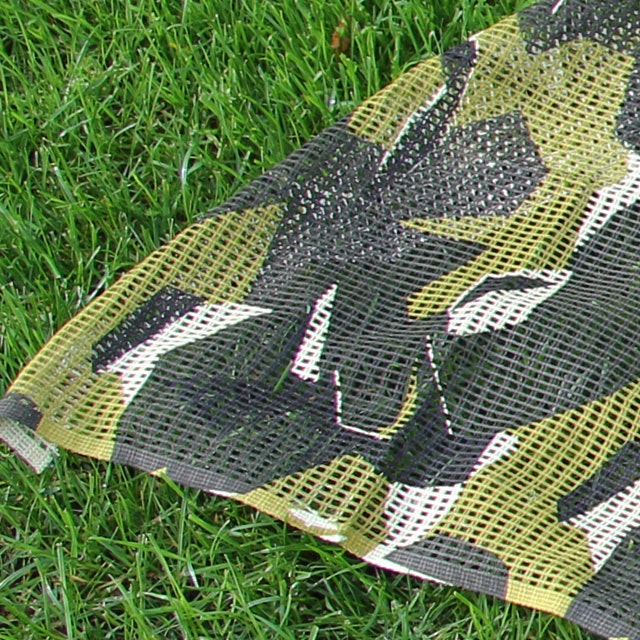 A Scrim Scarf M90 product picture also showing summer grass.