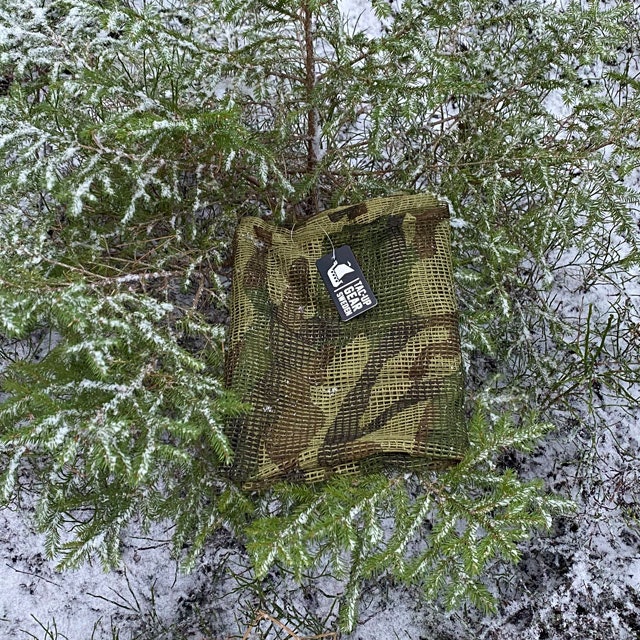 a Scrim Net Scarf Woodland in Swedish forest winter scenery