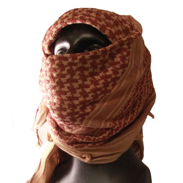 A Shemagh Khaki/Brown draped around face and head on a mannequin.