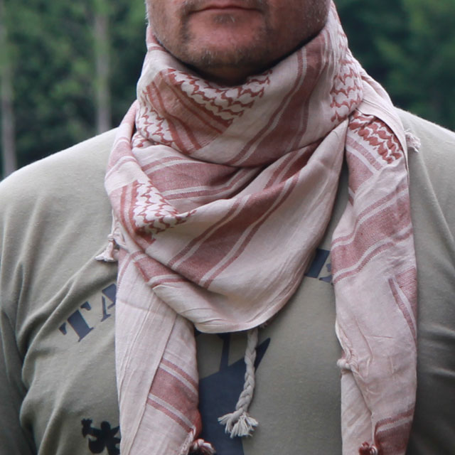 A Shemagh Light Khaki/Brown worn as scarf in Swedish summer scenery.