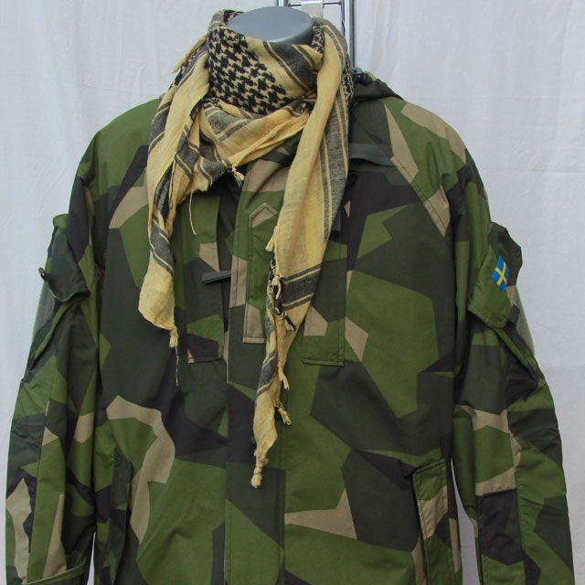 Product photo of a Shemagh Yellow/Black together with a NCWR Jacket.