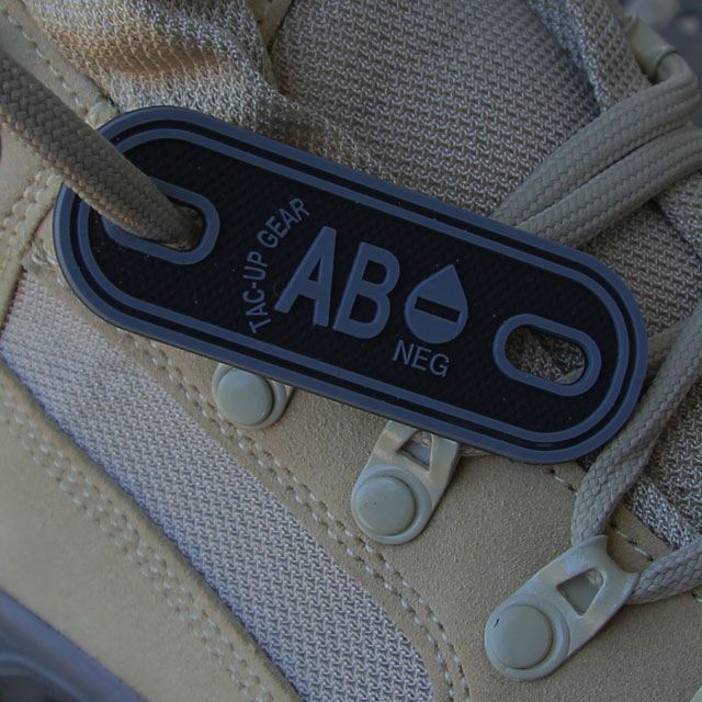 AB- Bloodtype Tag Black PVC on shoelace.
