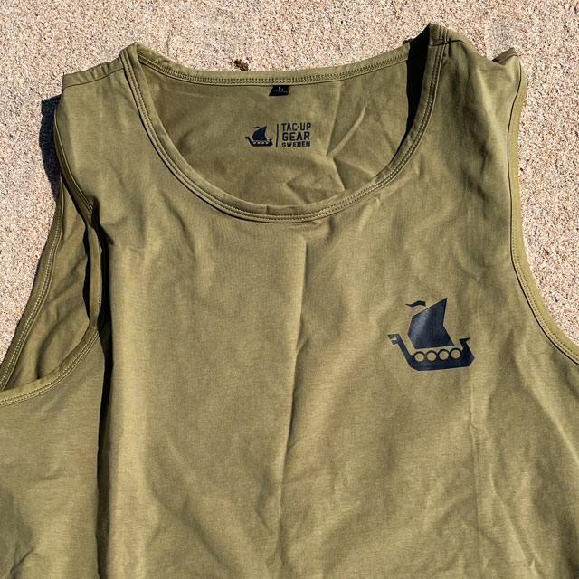A closer look on a Tank Top Khaki Green from TAC-UP GEAR laying flat on the beach
