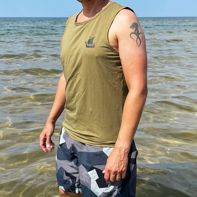 Tank Top Khaki Green from TAC-UP GEAR on model at the ocean seen from an angle