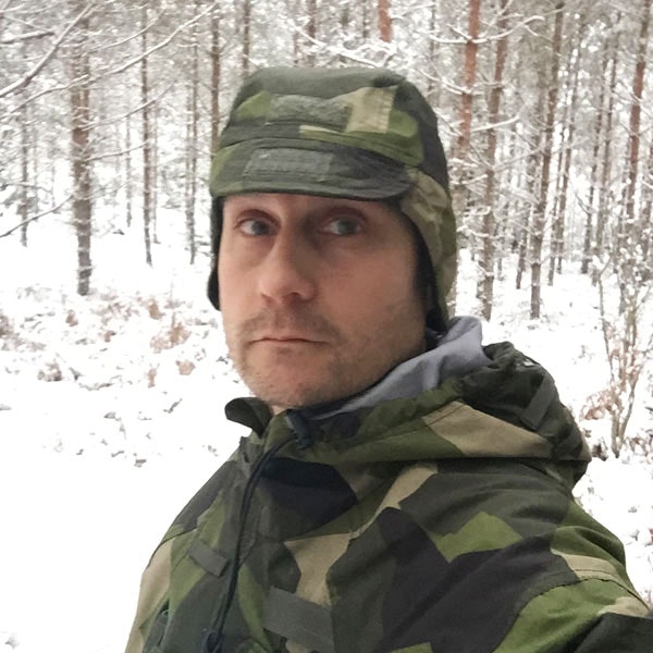 Snow on a Thermal Cap M90 in Swedish winter nature.