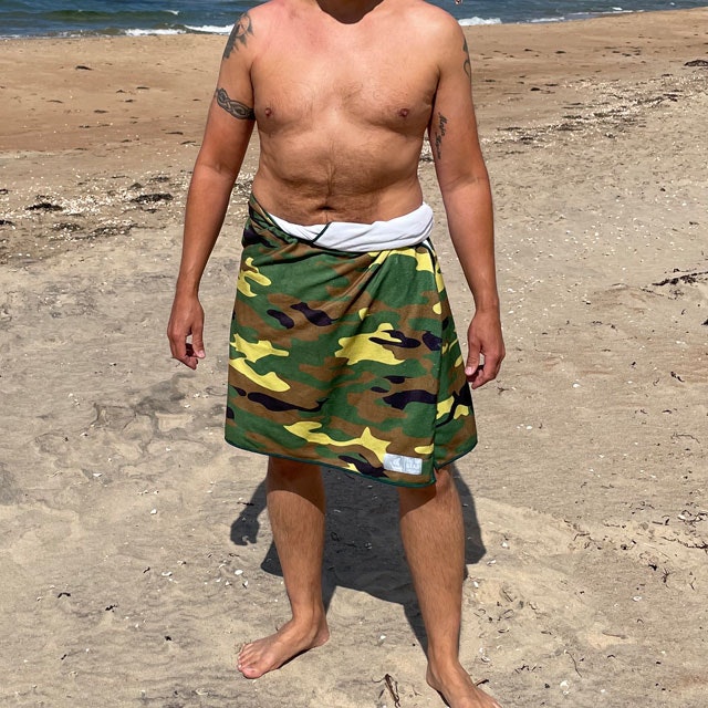 Towel Camouflage from TAC-UP GEAR wrapped around models waist on the beach and seen from the full front
