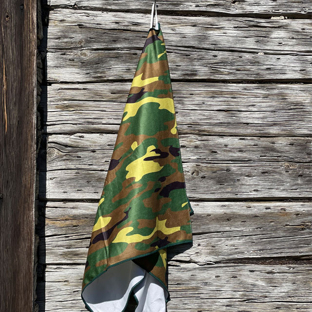 Closer look on a Towel Camouflage from TAC-UP GEAR hanging on a house wall