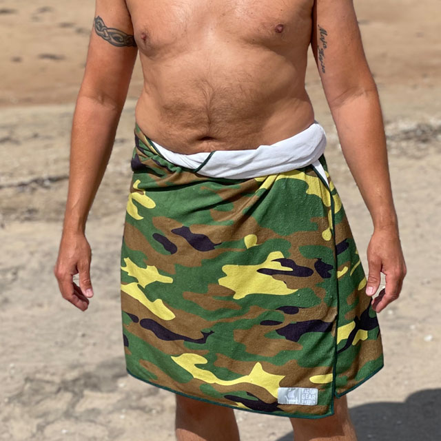Towel Camouflage from TAC-UP GEAR wrapped around models waist on the beach and seen from the front