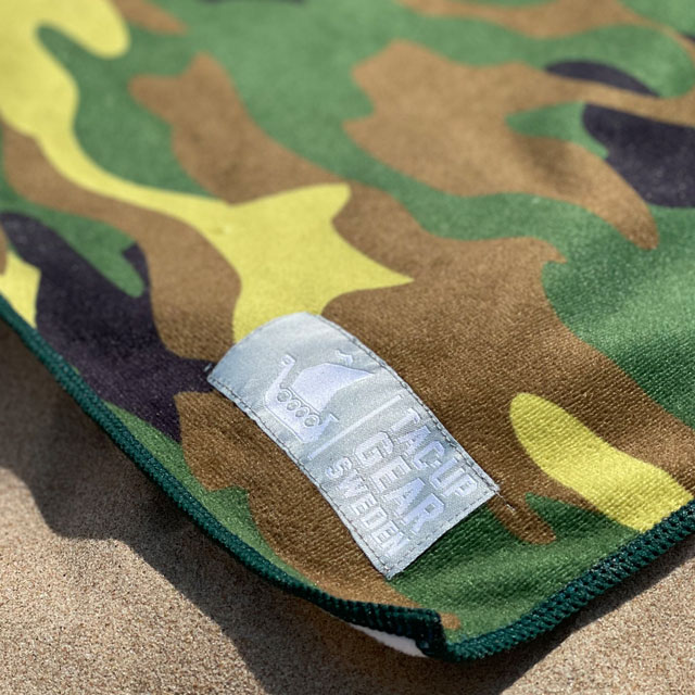 A closer look at a Towel Camouflage from TAC-UP GEAR laying in the sun on the beach
