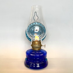 Liten blå väggfotogenlampa med blå reflektor