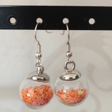 Örhängen glasglob med orange stjärnglitter