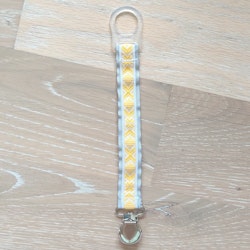 Napphållare med gult dräktband