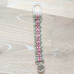 Napphållare med rött dräktband