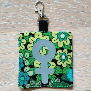 Reflex kvinnosymbol på grön och blå blommigt nr.22