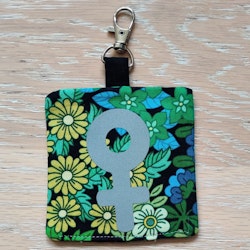 Reflex kvinnosymbol på grön och blå blommigt nr.16