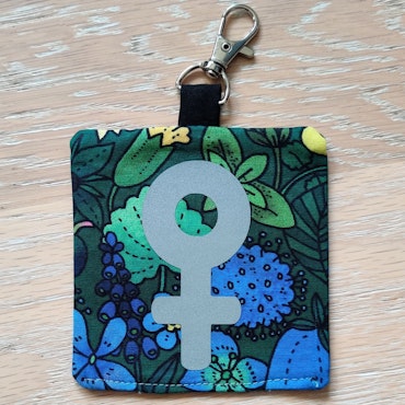 Reflex kvinnosymbol på grön och blå blommigt nr.29
