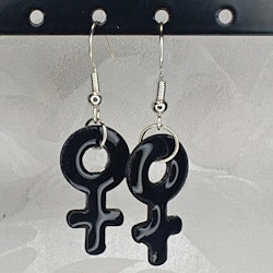 Örhängen med små kvinnosymboler i black
