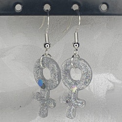 Örhängen med små kvinnosymboler med glitter silver