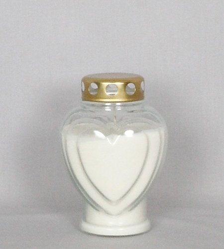 Ett oljeljus i hjärtformat glas med guldlock