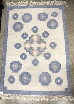 CARPET, red cloth, signed E.
