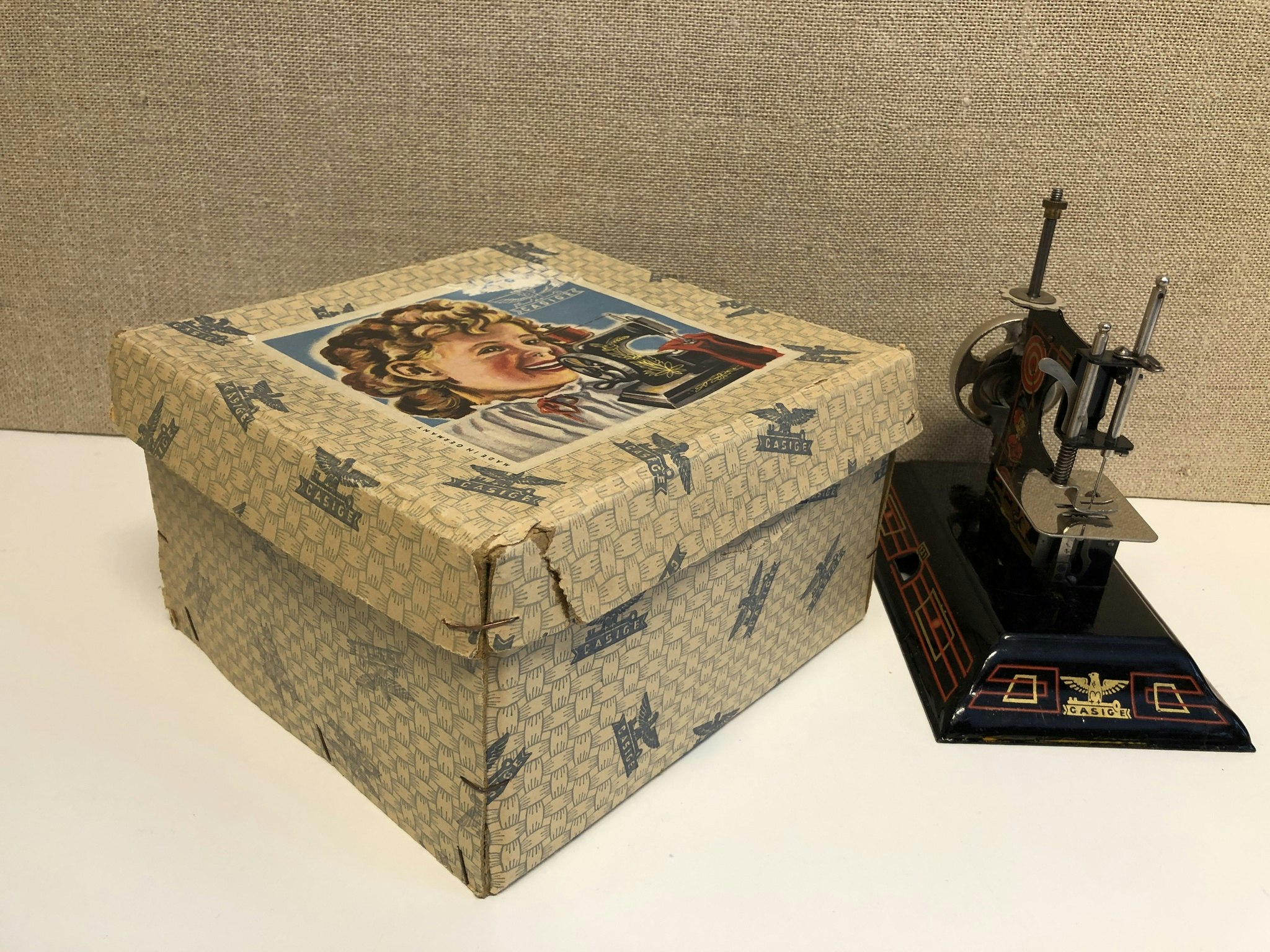 SEWING MACHINE, metal, children's model, original box, Casige, Germany, first half of the 20th century.