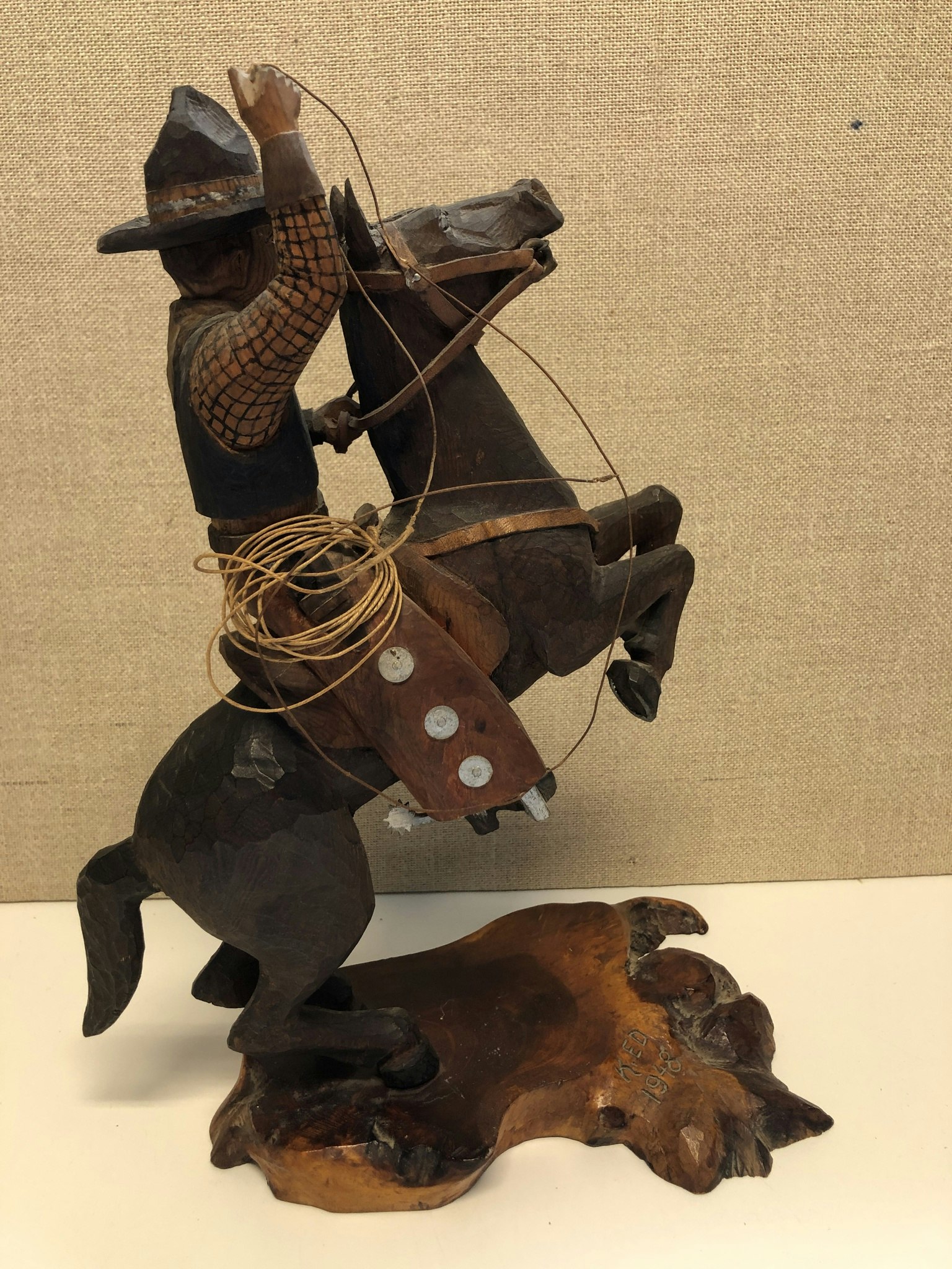 WOODEN SCULPTURE, Cowboy, signed KED 1948.