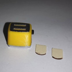 Brödrost Rostis och 2 skivor bröd 1:18