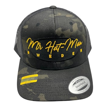 YP6511MC Multicam Trucker Mesh Black with black oval and yellow text