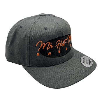 YP6606 Classic Snapback Dark Grey with black front oval and orange text