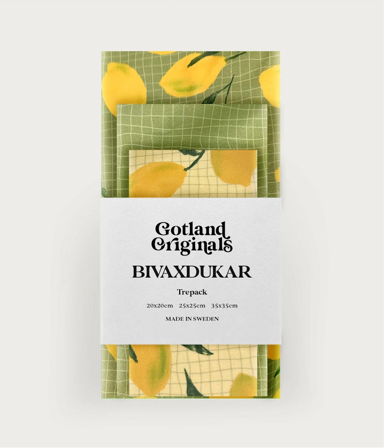 Bivaxduk 3-pack med mönster av gula citroner mot en grön bakgrund samat gula citroner mot en krämvit bakgrund