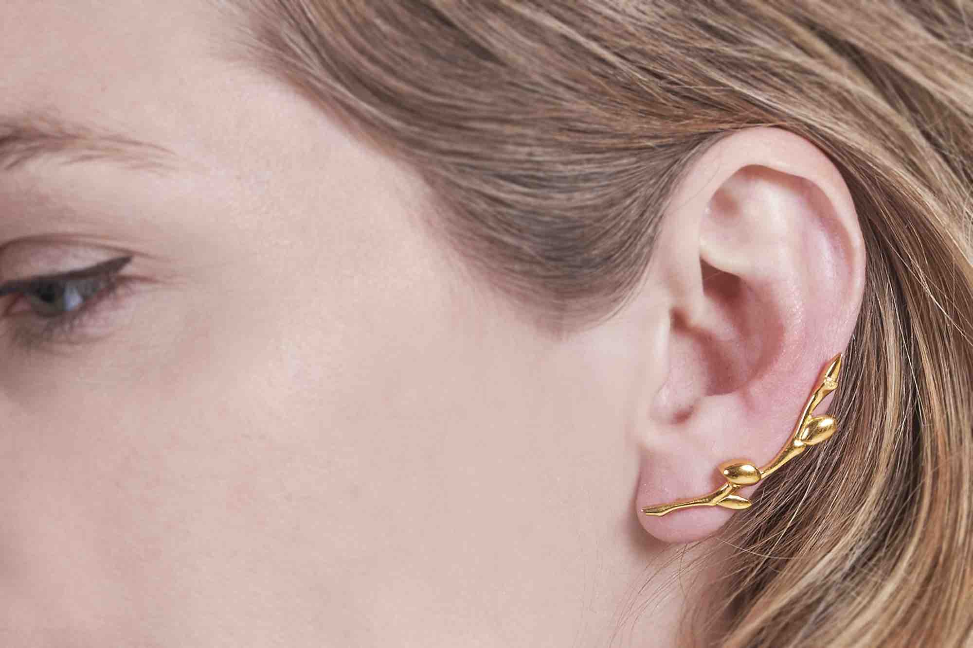 Soldiser Embla Gold Earring left on model