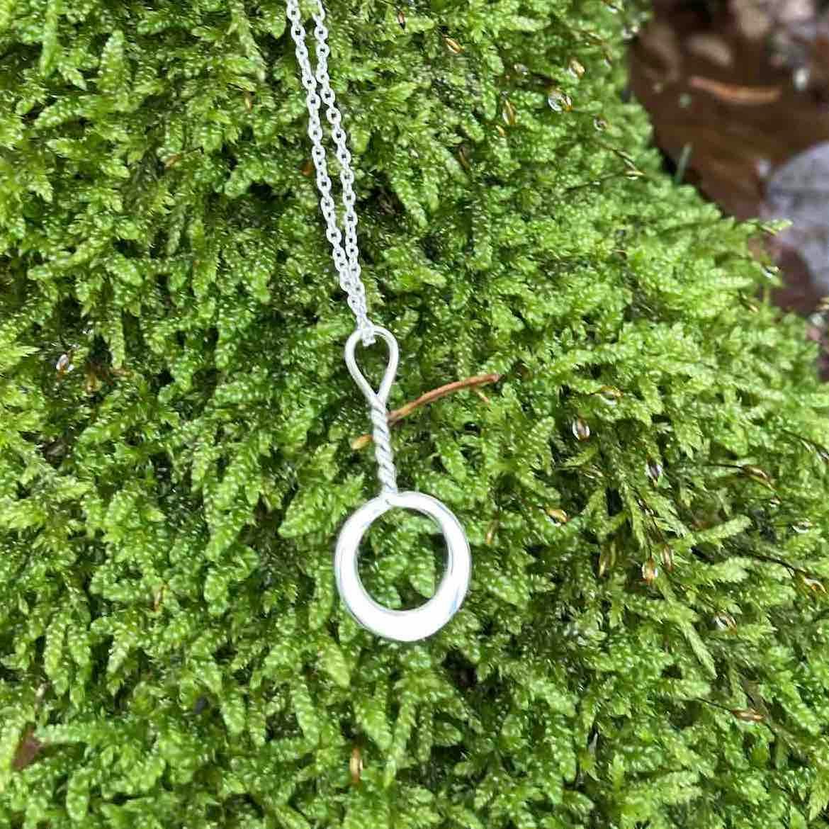 Soldiser Goddess Night Silver Necklace on moss