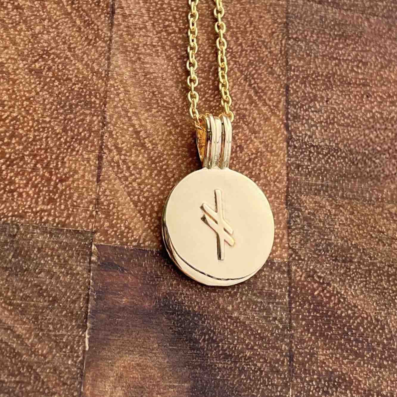 Soldiser Rune Pendant As Gold Necklace on Wood