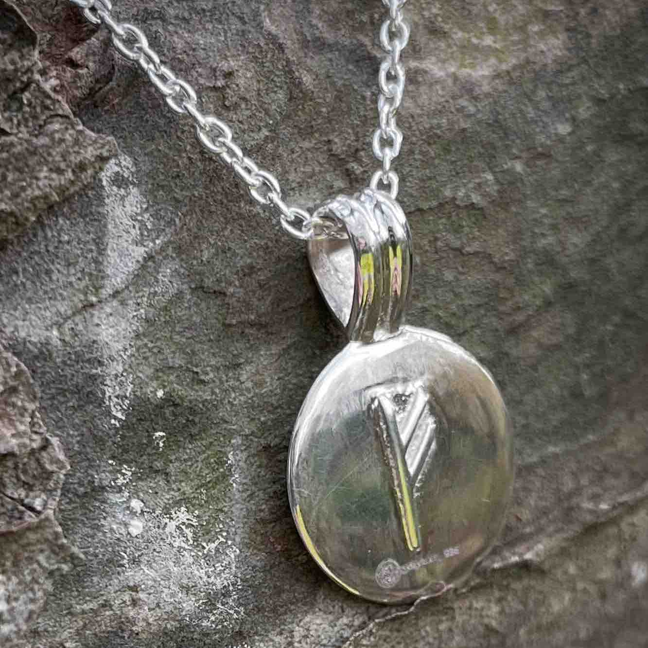 Soldiser Silver Fehu Rune Necklace on wood