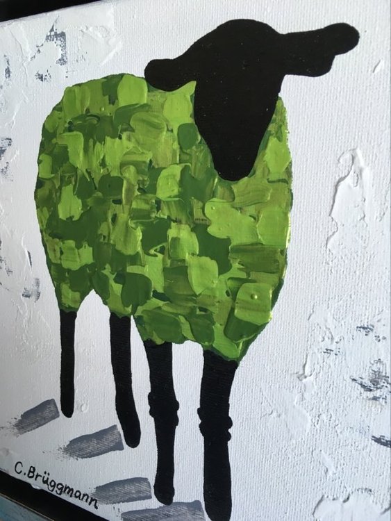 Färgglad liten tavla med får som du kan ställa eller hänga i princip var som helst. Glad grön färg.