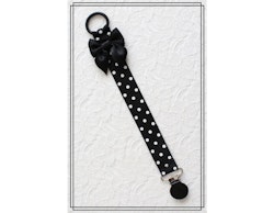Napphållare svart med vita prickar och rosett - svart clip