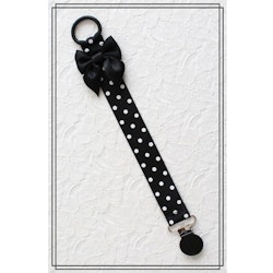 Napphållare svart med vita prickar och rosett - svart clip