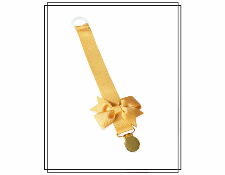 Guldfärgad napphållare med Gerda-rosett