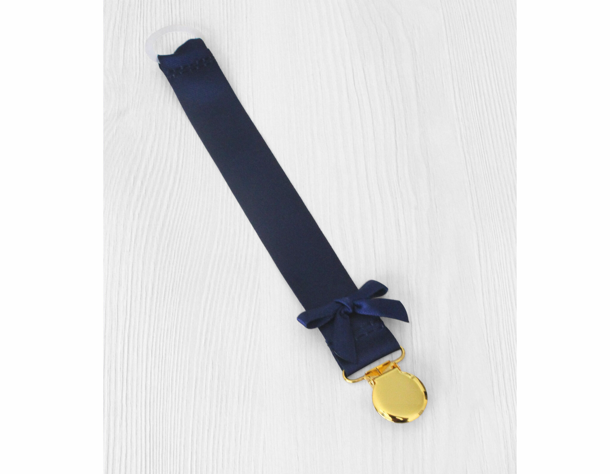 Marinblå napphållare med liten rosett - guld