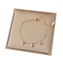 Elegant guldfärgat armband med rosa kristaller 16–20 cm