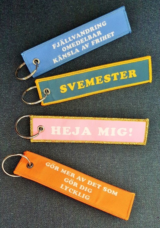 Gör mer av det som gör dig lycklig  Nyckelring/tag