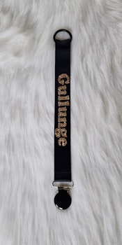 Gullunge guldglitter, svart clips