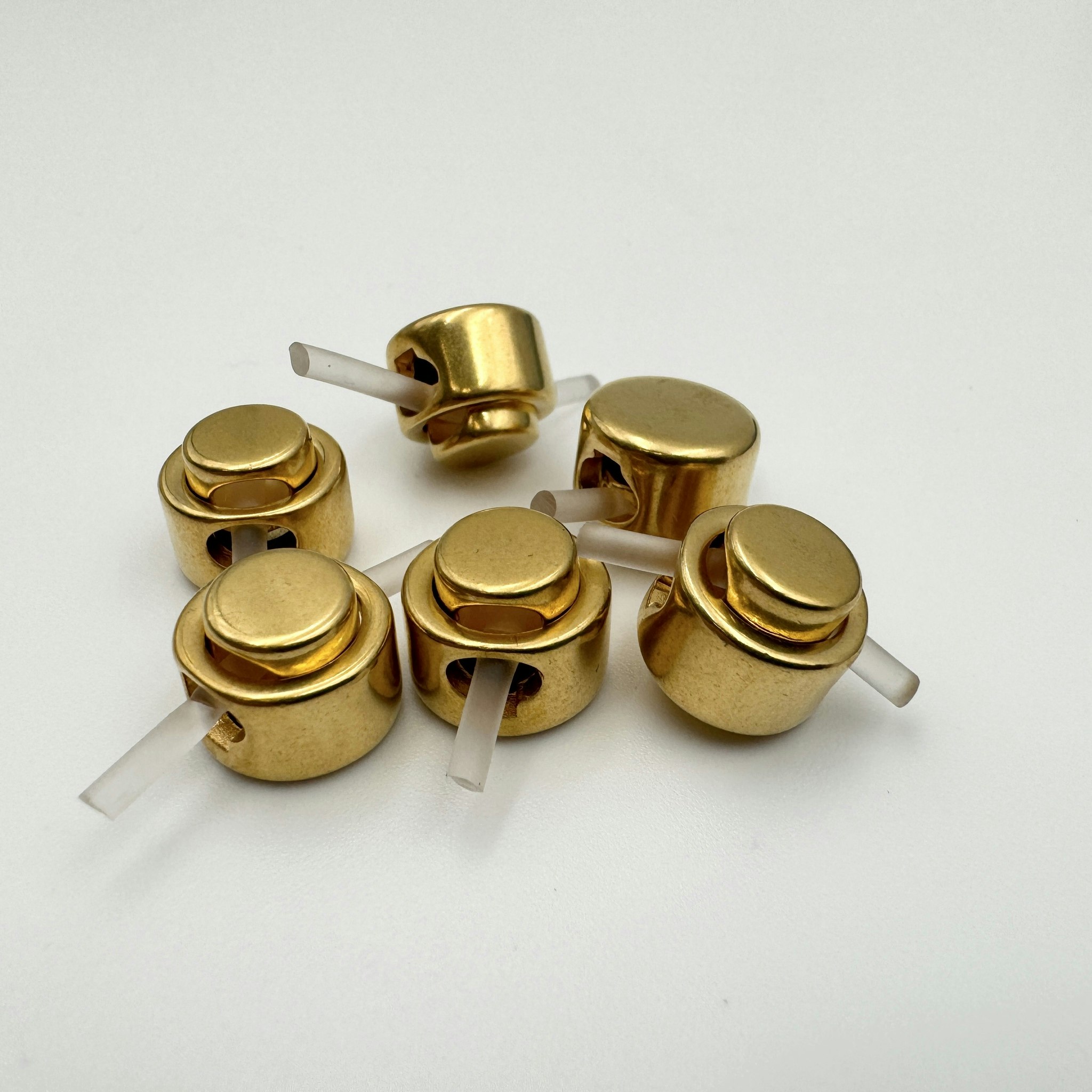 Snörstopp guld Escad*