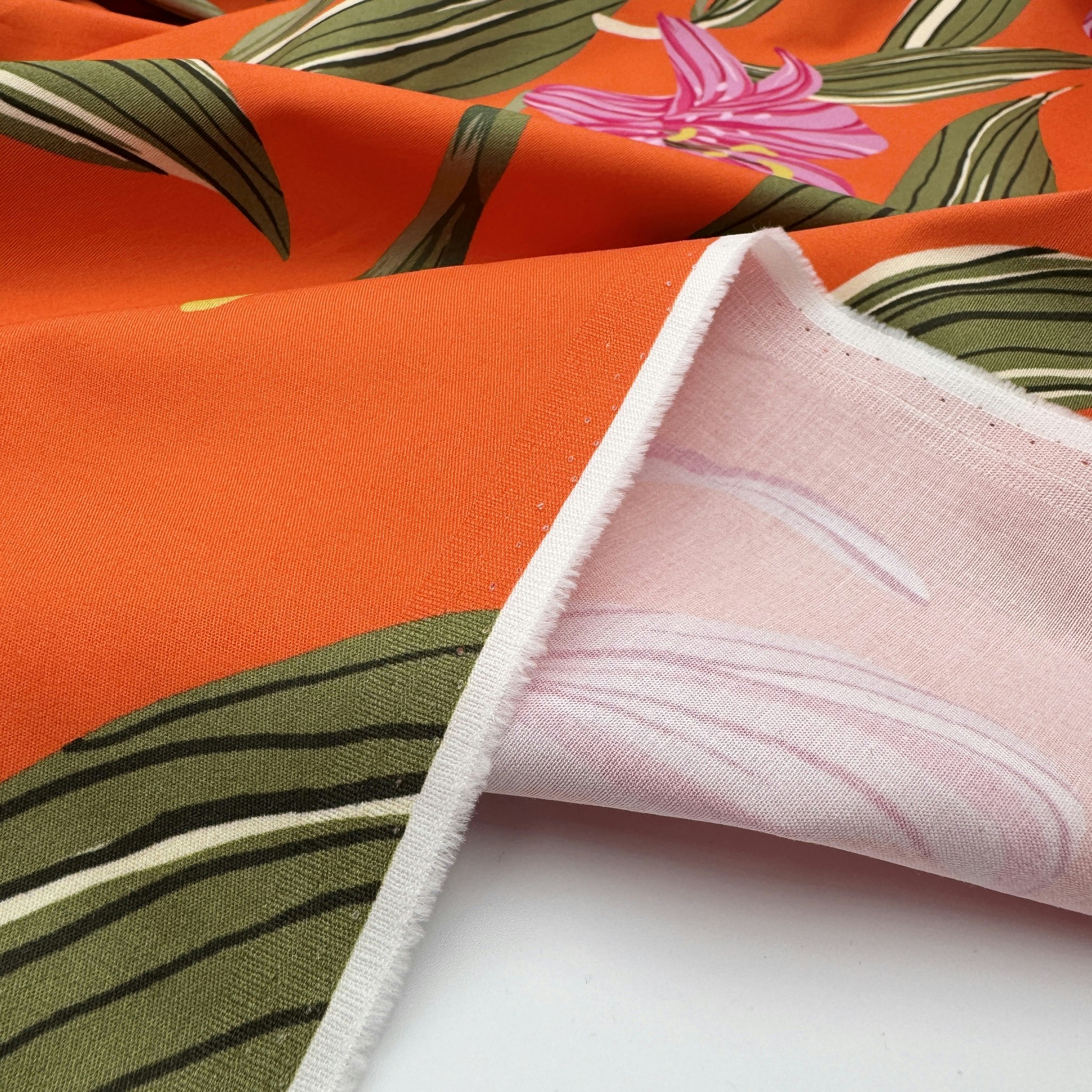 Bomull/elastan orange storblommig Hugo B***