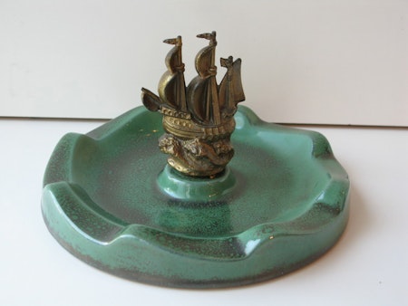 Green bowl with metal ship